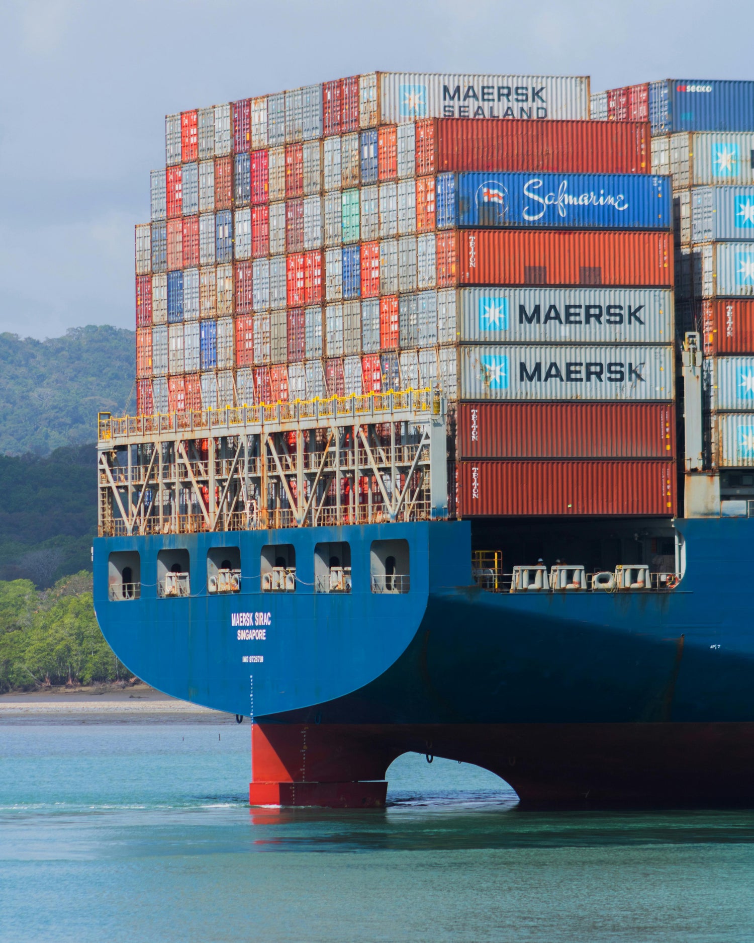 Container ship with Maersk containers sailing on a body of water.